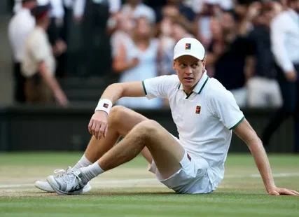 Jannik Sinner holding the Wimbledon trophy before his knee injury ended his 2026 tennis season