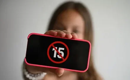 Teenager using a smartphone as the Turkey social media ban for under-15s takes effect on November 1